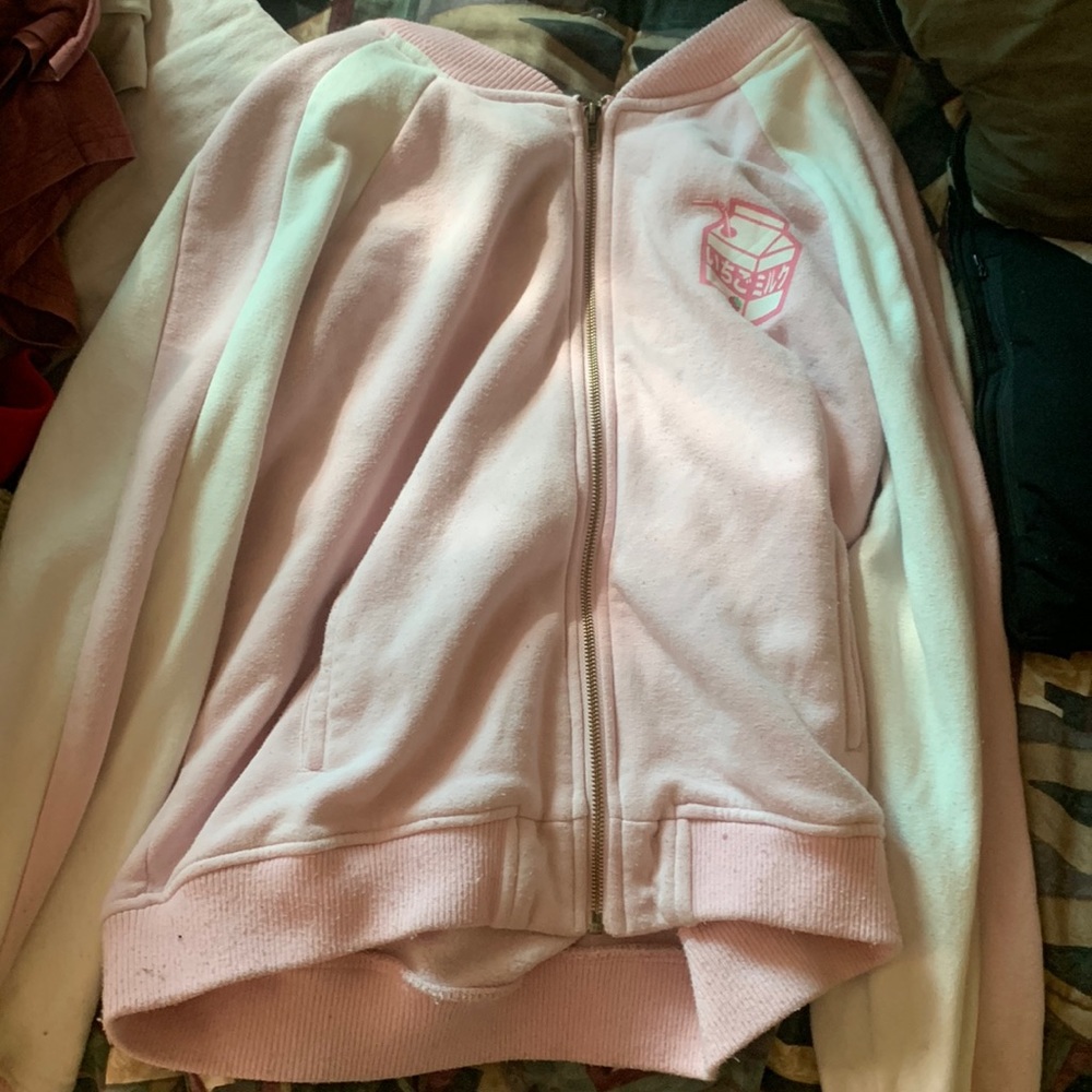 A pink strawberry jacket with pockets